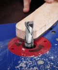 Pro Grade Extra Long Compression Flush Trim Router Bit with one quarter inch shank and one half inch cutting diameter in action