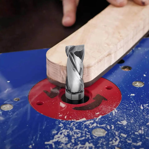 Pro Grade Extra Long Compression Flush Trim Router Bit with one quarter inch shank and one half inch cutting diameter in action