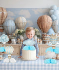 Table with Blue Hot Air Balloon Honeycomb Centerpieces For Tables With Clouds Travel Adventure Theme 8 Piece Set at kids party