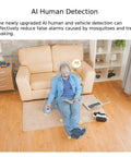 Smart 5Mp E27 Screw In Surveillance Camera with AI Motion Tracking shows human detection feature in living room setting.