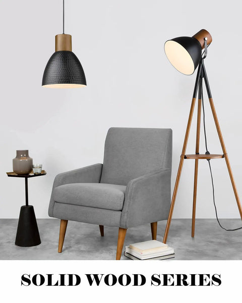 Hammered Pendant Light With Solid Wood And Metal Shade In Black Finish above modern chair in living room setting