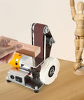 Mini Belt Sander Grinder With 7 Speed Adjustable Settings For Metal And Wood in use, sanding wood block with polishing wheel.