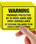 Keep Drifters From Meddling With Your Patch With This Legit Heavy Duty Security Surveillance Decal Sticker showing hand holding yellow warning signs.
