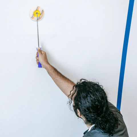 Person using a Slick Paint Roller Brush And Corner Edger For Snug Corners Window Trim And Door Frames Dang Handy Tool.