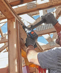Builder using PROFACTOR 18V Connected Ready Half Inch Hammer Drill and Driver Bare Tool on wooden framework