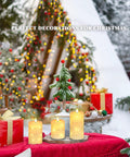 Ivory Real Wax Flameless Taper Candles Set Of 3 With Copper String Lights on Christmas table with decorated tree background