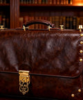 Top Shelf Solid Brass Nailhead Studs With A Killer Gold Shine Featuring No Fuss Flat Head Screw Back Rivets Made For Heavy Duty Leather Handbag Fixes And Smooth Diy Craft Projects That Truly Deliver on a vintage brown leather handbag.