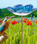 Glass Flower Pattern Bird Bath With Metal Stake For Outdoor Garden Yard Lawn Decor Blue Glass Bird Feeder Bowl Attracts Birds For Bathing And Adds Colorful Charm with a bird perched nearby.