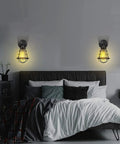 Bedroom with two wall lamps, featuring Metal Light Cage Guard 4 Pack For Pendant Lights And Wall Lamps Edison Bulb Shield E26 E27 Compatible Industrial Look Dope DIY Lighting Accessories Great For Retro Industrial Style Home Upgrades And DIY Projects, casting warm light above bed.