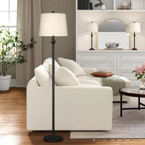 Traditional Black 3 Piece Lamp Set With White Fabric Shades Table Lamps And Floor Lamp Trio Perfect For Living Room Bedroom Study Includes Two 26.5 Inch Lamps And One 57.5 Inch Floor Lamp 100W E26 Compatible shown in modern living room.