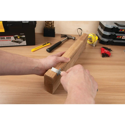 Person using Six Inch Stainless Steel Sliding Depth Gauge with Ultra Fine 64T Graduations for precise measurements on wood