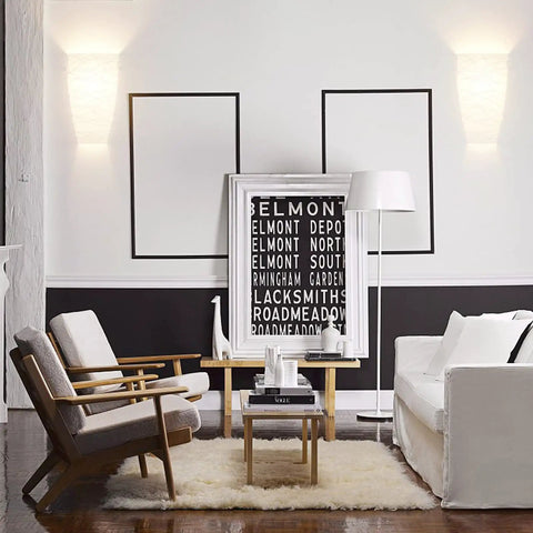 Living room with Dope Wall Sconces Set Of Two Modern Wall Mount Light Fixtures, acrylic shades illuminating the wall.