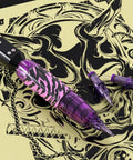 Wireless Tattoo Pen Kit For Beginners With 10 Needles And 7 Ink Colors, cordless pen with purple design on intricate background