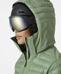 Side view of woman in green Womens Slick Waterproof Insulated Ski Jacket With H2Flow Tech LIFE Pocket Ski Free PrimaLoft