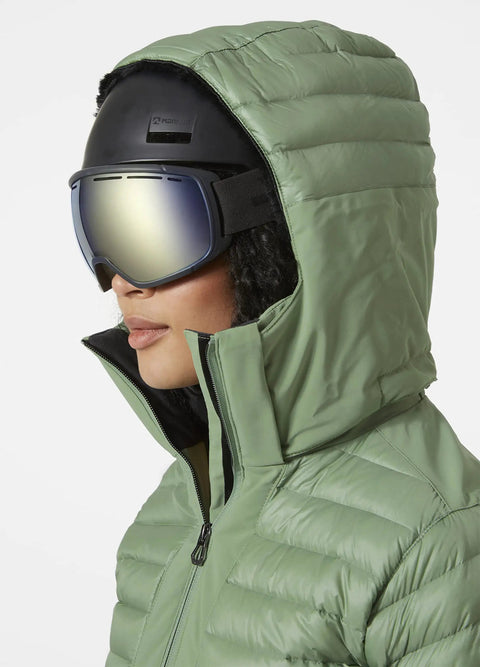 Side view of woman in green Womens Slick Waterproof Insulated Ski Jacket With H2Flow Tech LIFE Pocket Ski Free PrimaLoft