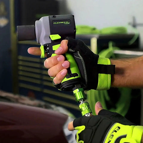 Person using Pro High Flow Air Tool Coupler And Plug Kit, 7 Piece, 1/4 Inch NPT, Push To Connect System with hand tool.