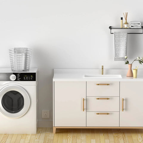 Bathroom vanity with Beech Wood Drawer Pulls 10 Pack Gold Finish Cabinet Handles next to washing machine, minimal decor.