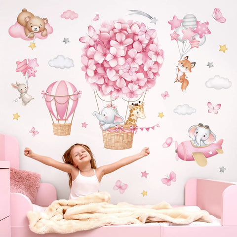 Cute Animal Wall Stickers Set With Hot Air Balloon Elephant Giraffe Bear And Airplane Designs For Girls Room Nursery Baby Bedroom Easy Peel And Stick Waterproof PVC Decals with child in pink room.
