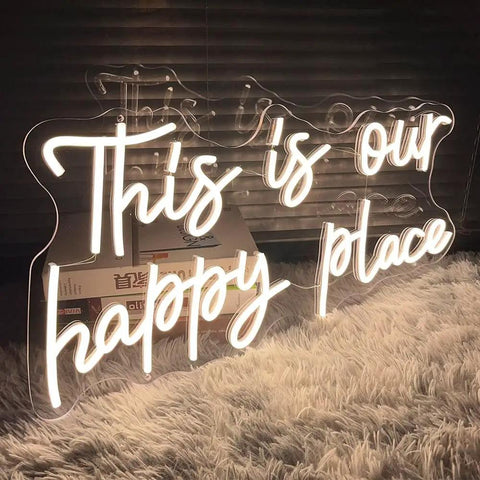 Customizable Neon Sign For Wall Decor Warm White LED Neon Light With Sturdy Acrylic Backplate 19.7 Inch By 9.8 Inch Indoor Display Ideal For Birthday Parties Weddings Christmas Living Rooms And Epic Gift For Adults Teens."This is our happy place" text in warm white LED on acrylic.
