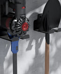 Wall-mounted garage tool organizer holding a vacuum and shovel, featuring anti-rust stainless steel and rubber pad protection.