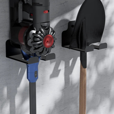 Wall-mounted garage tool organizer holding a vacuum and shovel, featuring anti-rust stainless steel and rubber pad protection.