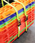 Heavy Duty Ratchet Straps 4 Pack 1-1/2 X 15 Ft With Coated Steel Ratchet securing colorful plastic traction boards