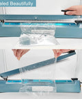 12 Inch 5mm Impulse Heat Sealer Machine With Replacement Parts Bundle in use sealing a plastic bag, demonstrating sealing action.
