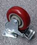 2pcs Red TPR Swivel Caster Wheels with Brake for Shopping Carts, close-up view showing wheel and metal bracket.