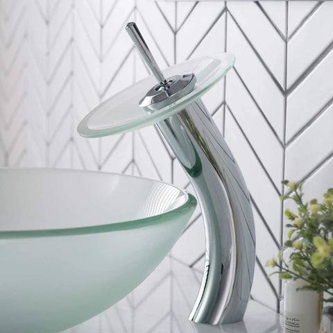 Tall Waterfall Vessel Sink Faucet With Frosted Glass Disk In Chrome Finish A Modern Bathroom Centerpiece That Pops Your Decor Built Tough Metal Construction For Smooth Flow And Easy Install. Elegant faucet beside matching sink.