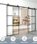Double Barn Door Set 72 By 96 Inches With 12 Feet Hardware Kit Includes Two 36 By 96 Clear Tempered Glass Panels Aluminum Frame Pocket Interior Door Easy Assembly Black Top Mounted Hardware showcasing installed doors with black frame.