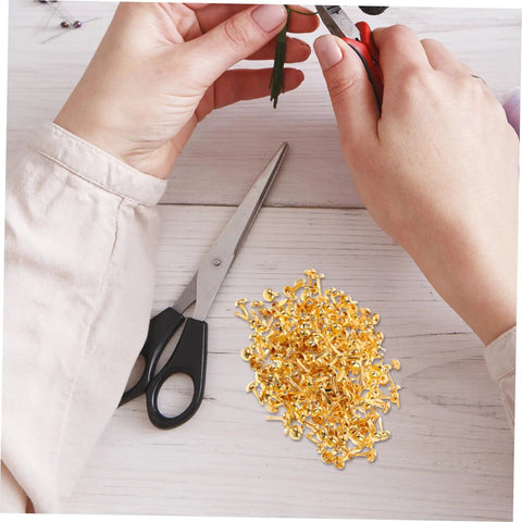 Person using tools with 200 Pieces Metal Paper Fasteners Brads Set For Paper Crafts And Scrapbooking Decorative Clips Miniature