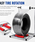 Hella Adjustable Tire Wrap Dispenser Stand For Car And Truck Wheels With Dual Roller Base Smooth Rotating Platform, showing heavy-duty design.