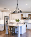 Black Farmhouse Wagon Wheel Chandelier With Six Lights, 24 Inch Rustic Pendant Ceiling Light in modern kitchen setting
