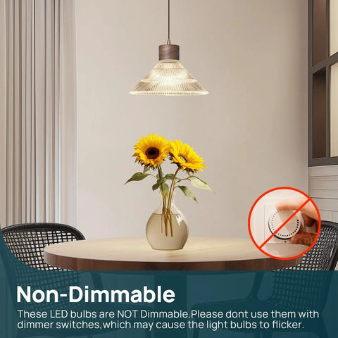 Dining room with pendant lighting using A19 LED Light Bulb 60W Equivalent, 8.5W 4000K Cool White, vase with sunflowers on table.