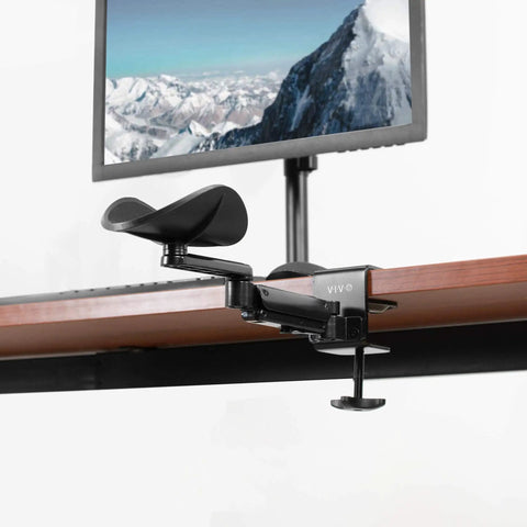 Two Pack Clamp Adjustable Armrests Transform Your Home Office Into A Hella Comfy Haven With Flexible 360 Rotating Elbow Support And Sturdy Steel Base Stand For Epic Desk Setups In Classic Black mounted on a desk.