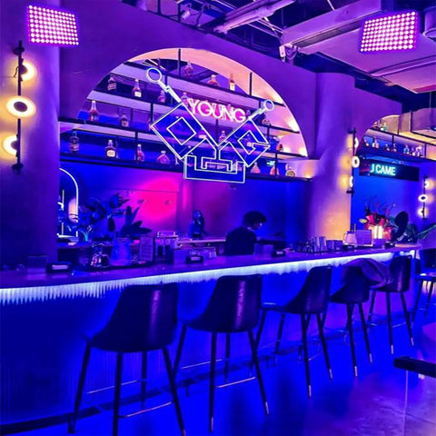 Bar with ambient lighting using Two Pack 100W UV Black Lights For Glow Parties And Stage Lighting IP65 Waterproof Beefy Ultraviolet Lamps