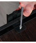 Close-up of heavy duty side mount ball bearing drawer slides pair during installation with a screwdriver on wood.