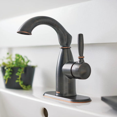 Mediterranean Bronze Rustic Farmhouse Bathroom Faucet With One Handle For Single Hole Install And Optional Deck Plate Easy Temperature And Water Control For That Classic Farmhouse Vibe on a white countertop