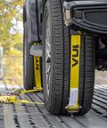 Heavy Duty Auto Hauler Car Tie Downs With Rolling Idler Three Cleat, 120 Inch Length, 4 Pack, Classic Yellow in use on tires