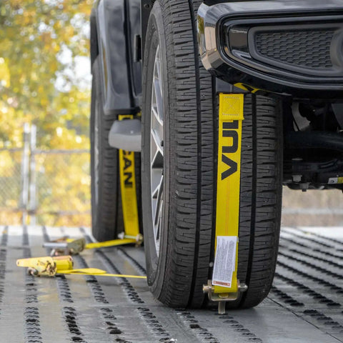Heavy Duty Auto Hauler Car Tie Downs With Rolling Idler Three Cleat, 120 Inch Length, 4 Pack, Classic Yellow in use on tires