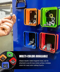 Multi-color collapsible magnetic parts tray with double-sided base holding screws and bolts on metal surface.