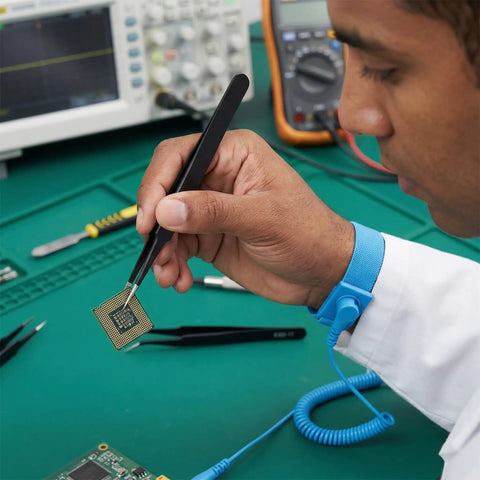 Technician using tweezers from All In One 10 Piece Pro Grade Precision Tweezers Set With Pry Tool, ESD Safe Stainless Steel Kit for electronics repair.