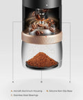 Portable Burr Coffee Grinder With 80 Precision Settings For Single Dose Brewing Compact Travel Mill showing aluminum housing and ground coffee.