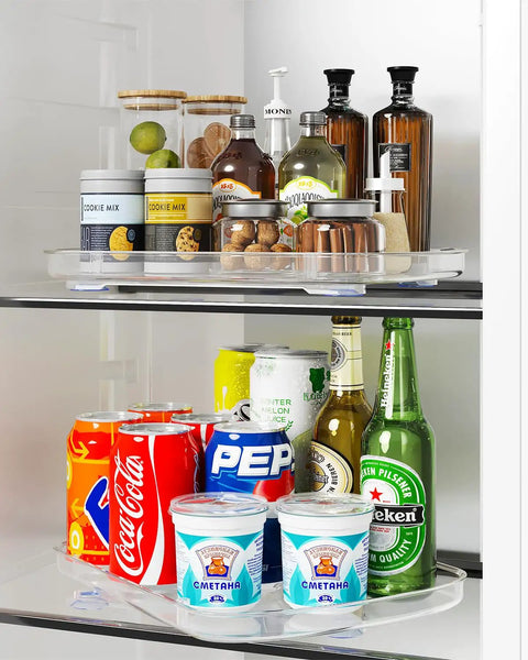 Clear Lazy Susan For Refrigerator And Pantry Cabinet Two Pack 360 Degree Rotating Organizer with drinks and condiments.
