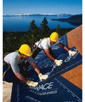Two workers installing Gotta Have This Top Grade Ice And Water Shield Roofing Underlayment Self Adhered Membrane on a roof.