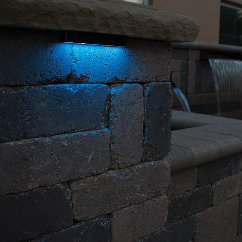 LED Color Changing Hardscape Light 6-Inch Multicolored With Oil Rubbed Bronze Finish illuminating stone wall