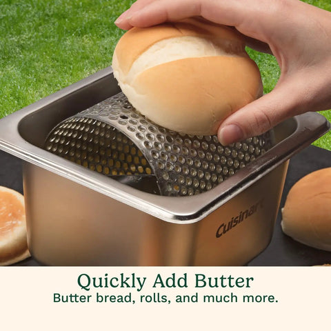 Hand using Stainless Steel Butter Wheel For Griddles And Grills Raised Bottom Butter Roller For Even Spreading On buns