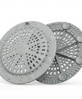 2 Pack Silicone Shower Drain Hair Catcher Designed For Sunken Tub Installations Heavy Duty Strainer with water droplets on grey surface.