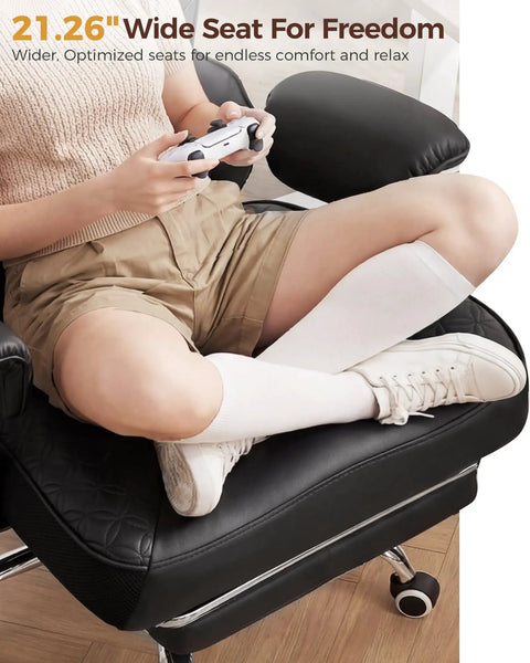 Person sitting on Big And Tall Office Chair For Heavy Duty Comfort With Deluxe Embossed Leather High Back Ergonomic Computer Chair With Foot Rest, showcasing wide seat