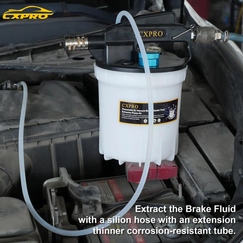 Pro Grade 24 Piece Brake Bleeder Kit With Vacuum Brake Fluid Extractor 2 Liter Capacity connected to car engine bay